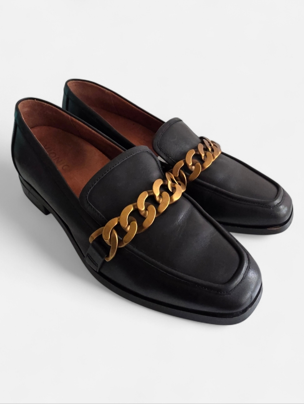 Vionic Black Leather Mizelle  Loafers with Gold Chain Accent.
